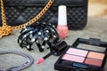 Women accessories: eyeshadow, nail polish, clip hair, handbag