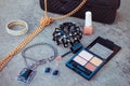 Women accessories: eyeshadow, nail polish, clip hair, handbag