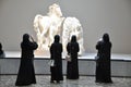 Women admiring antique Greek artworks in Louvre Abu Dhabi
