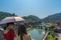 Women admiring Fenghuang Old Town