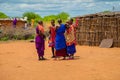 women from the African tribe Maasai in national dress in their village houses made of clay Royalty Free Stock Photo