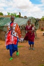 women from the African tribe Maasai in national dress in their village houses made of clay Royalty Free Stock Photo