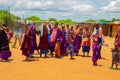 women from the African tribe Maasai in national dress in their village houses made of clay Royalty Free Stock Photo