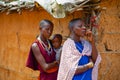 women from the African tribe Maasai in national dress in their village houses made of clay Royalty Free Stock Photo