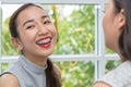 Women applying red lipstick. Beauty woman take lipstick, Girl friends helping with make-up. Girlfriends fooling around with makeup Royalty Free Stock Photo