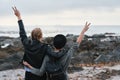 Women, back and friends at beach with peace sign, bonding and hugging. Freedom, travel and girls or females with v Royalty Free Stock Photo