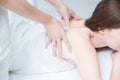 Women back pain massage in spa