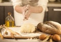 Women baker hands mixing recipe kneading butter, tomato preparation dough and making bread Royalty Free Stock Photo