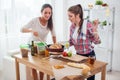 Women baking at home fresh bread in kitchen