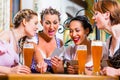 Women in Bavarian pub playing cards