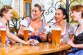 Women in Bavarian pub playing cards