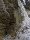 Women behind frozen waterfall