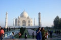 Women being photographed at the Taj Mahal in the early morning