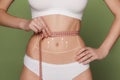 Women belly with the drawing arrows Royalty Free Stock Photo