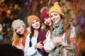 Women best friends smiling and walking at the city. Outdoors lifestyle fashion portrait