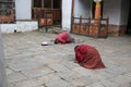 Women Bowing in Prayer In Buddhist Temple, Bhutan