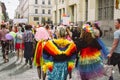 Women in bright clothing and with wings on Helsinki Pride festival on the street