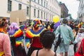 Women in bright clothing and with wings on Helsinki Pride festival on the street