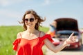 Women with broken car hitchhiking at countryside Royalty Free Stock Photo