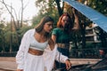 Two women with broken car on the road. Open hood Royalty Free Stock Photo