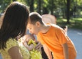 Women, brother and baby in a park.