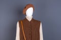 Women brown wool beret and waistcoat.