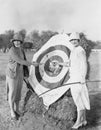 Women with bulls eye in archery target Royalty Free Stock Photo