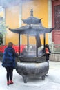 Female Buddhist prayers in the Lingyin temple, China Royalty Free Stock Photo