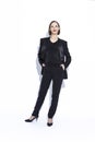 Women In Business. Full Length Portrait of Winsome Positive Confident Caucasian Business Woman in Black Suit Posing Over White Royalty Free Stock Photo