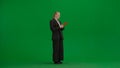Women in business suit on green screen with chroma key. Blonde business woman with red folder in hands. Royalty Free Stock Photo
