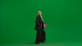 Women in business suit on green screen with chroma key. Blonde business woman with red folder in hands. Royalty Free Stock Photo