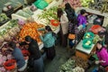 Women buying and seller groceries in a market in Thimphu, the capital of Bhutan