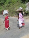 Women carry goods on their heads