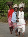 Women carry goods on their heads