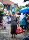 Women carry goods to the market in Bali, Indonesia