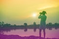 Women carrying a camera to watch the sunset