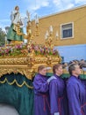 Women carrying float with religious sculpture of Virgin Mary during Holy Week processions in Spain