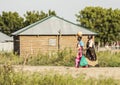 Women carrying goods, South Sudan