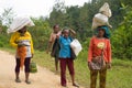 Women carrying sacks on head in Indonesia