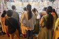 Women checking out jewellery in retails shop