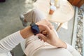 Women checking smartwatch on hand