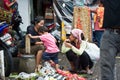 Women and child in polluted market in Bali, Indonesia.