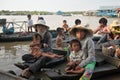 Women with children in the boat from Floating Village in Tonle Sap Lake, Cambodia Royalty Free Stock Photo