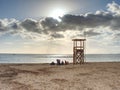 Women with children rest and playing on beach