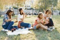 Women with children at sunset resting in the park, picnic, soap bubbles Royalty Free Stock Photo