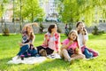 Women with children at sunset resting in the park, picnic, soap bubbles. Royalty Free Stock Photo