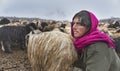 Women and children wake up in the morning to milk sheep, goats and yaks in very heavy snow conditions and very low temperatures at