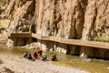 Women with childrenre doing laundry at the river Todra Gorge, Morocco Royalty Free Stock Photo