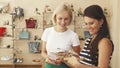 Women choosing shoes in shoe shop Royalty Free Stock Photo