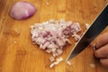 Women chopping red onion on wooden board Royalty Free Stock Photo